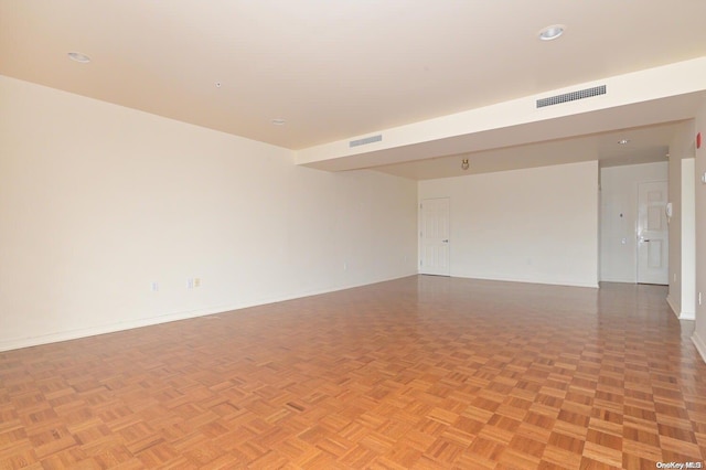 spare room with light parquet flooring