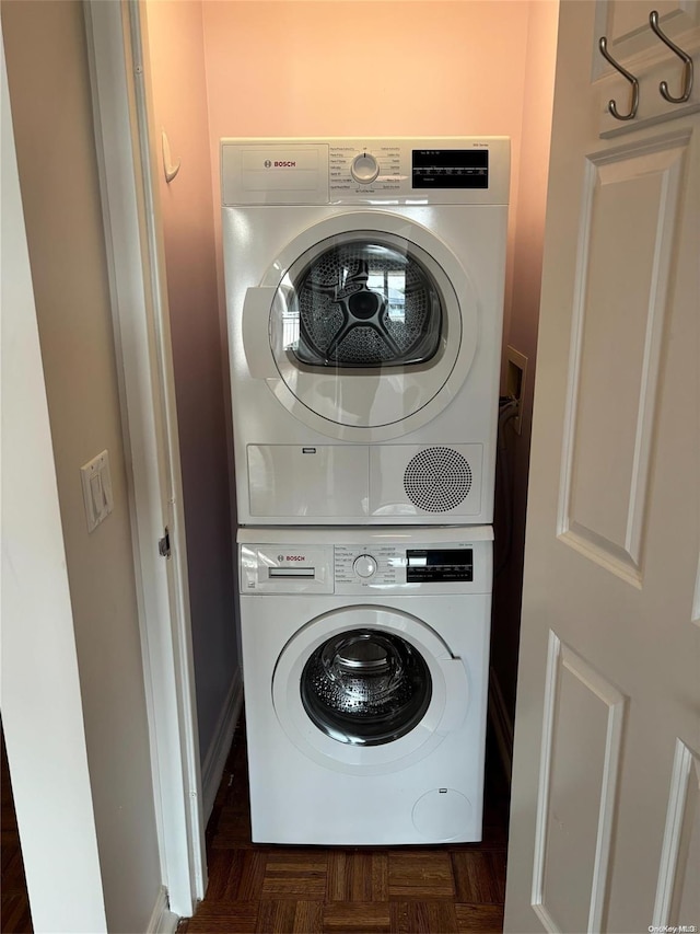 laundry room with stacked washer / dryer