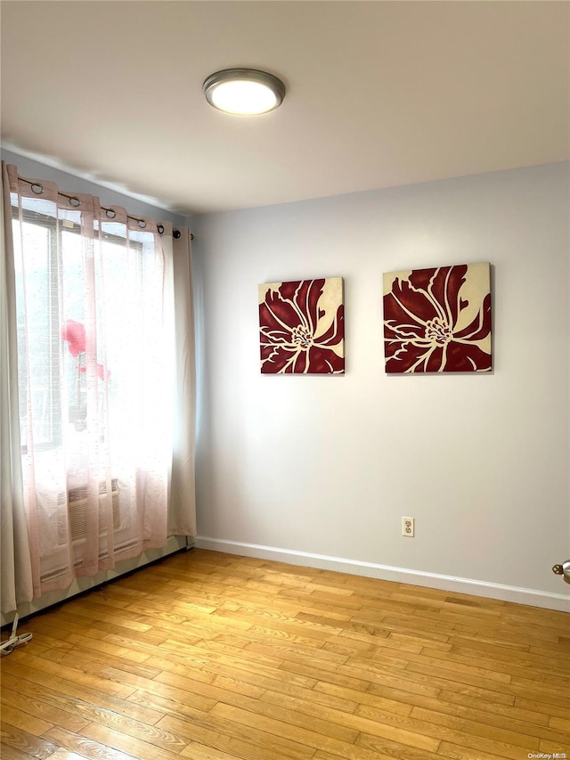 unfurnished room featuring light wood-type flooring