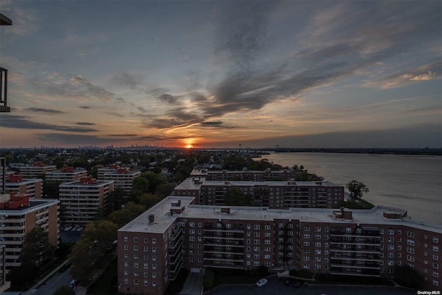 aerial view at dusk with a water view