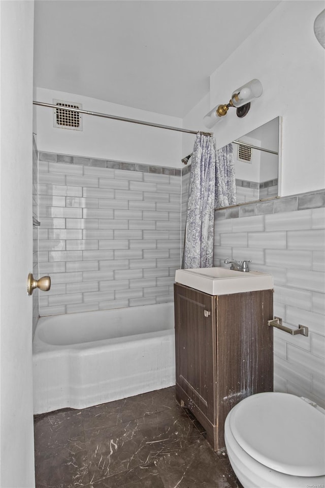 full bathroom featuring vanity, toilet, and shower / bath combo