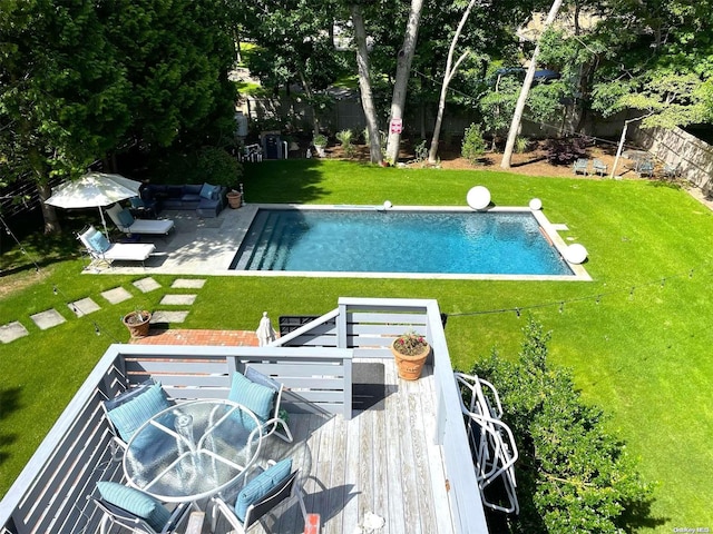 view of pool featuring an outdoor hangout area, a yard, and a wooden deck