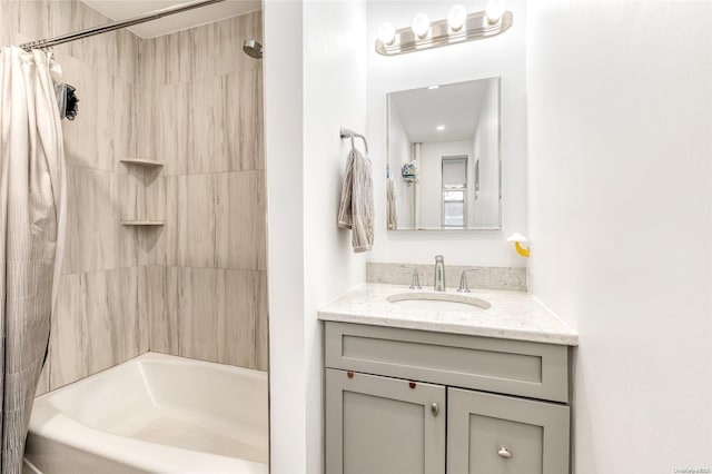 bathroom with shower / bath combination with curtain and vanity