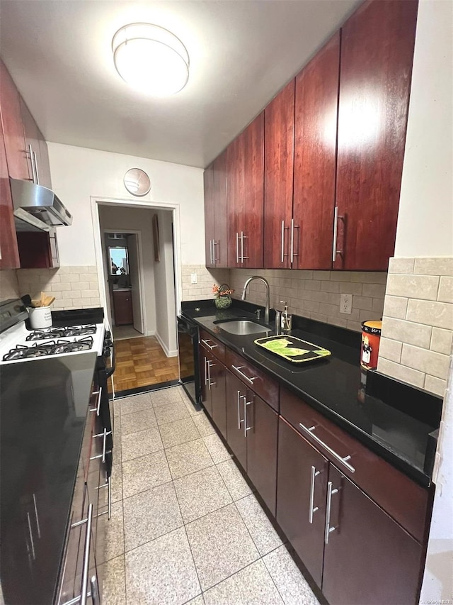 kitchen featuring white range with gas stovetop, black dishwasher, tasteful backsplash, and sink