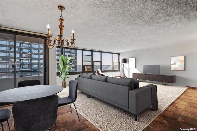 living room with a textured ceiling and an inviting chandelier