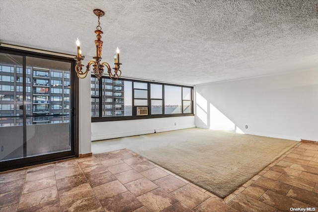 interior space with a chandelier and a textured ceiling