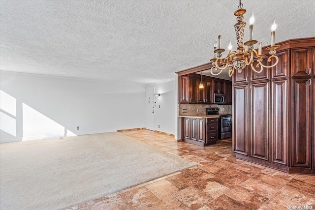 kitchen with a textured ceiling, dark brown cabinets, stainless steel appliances, and tasteful backsplash