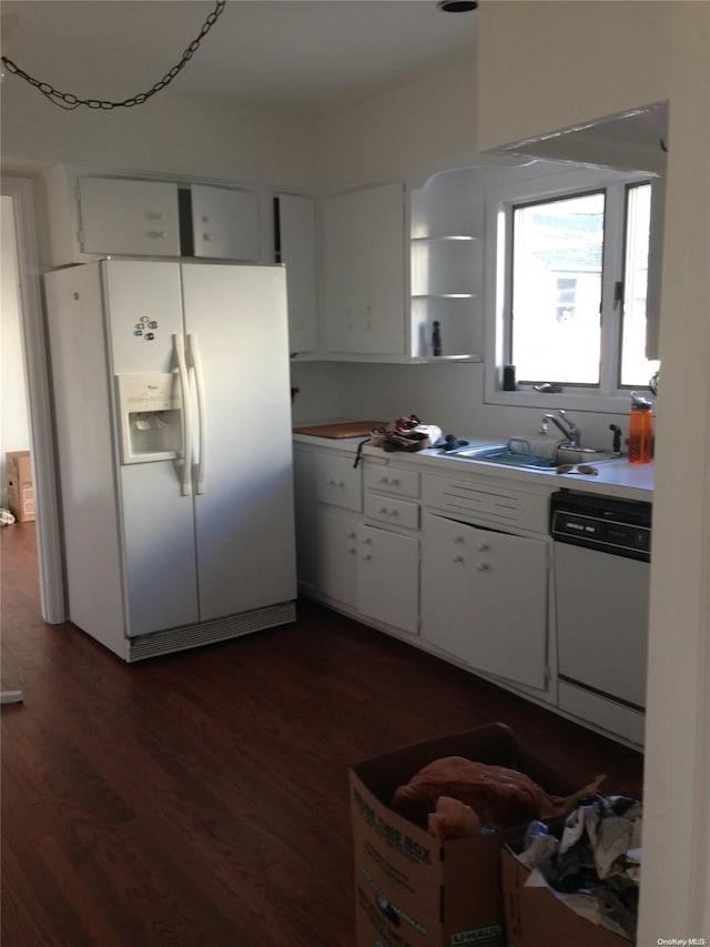 kitchen featuring white cabinets, dark hardwood / wood-style floors, white appliances, and sink