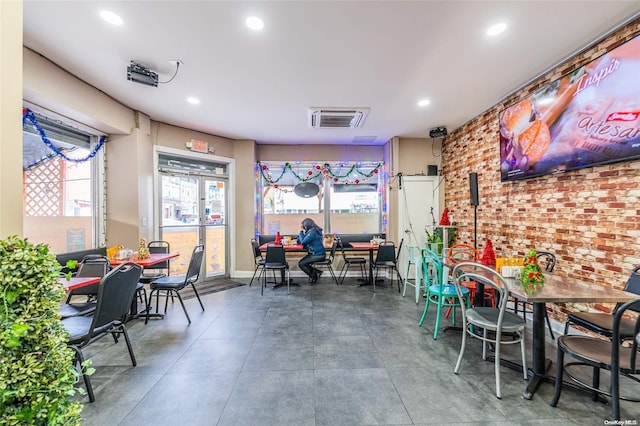 interior space featuring concrete flooring and a healthy amount of sunlight