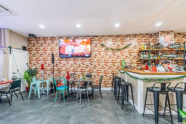 bar featuring brick wall