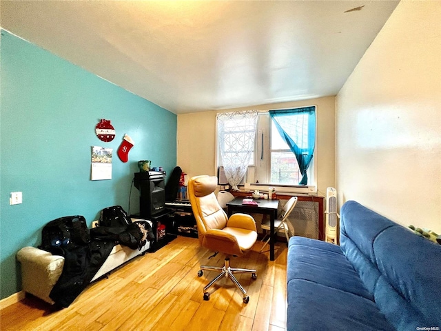 living area with hardwood / wood-style flooring