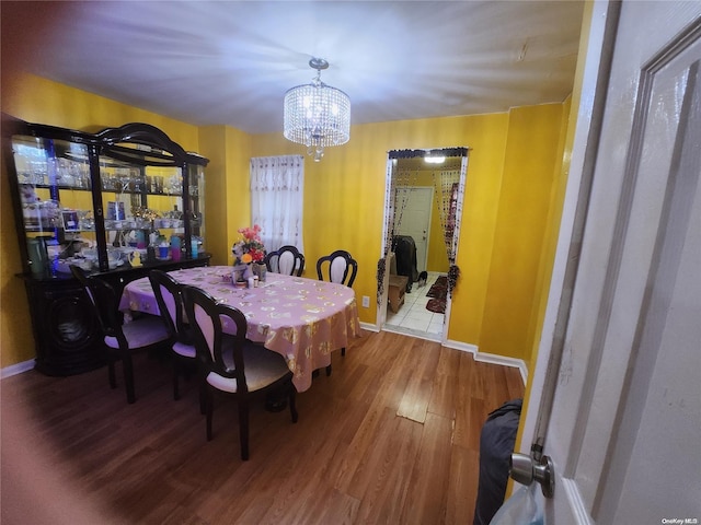 dining room with a chandelier and hardwood / wood-style flooring