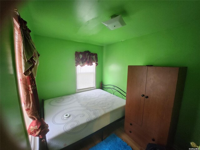 bedroom featuring wood-type flooring