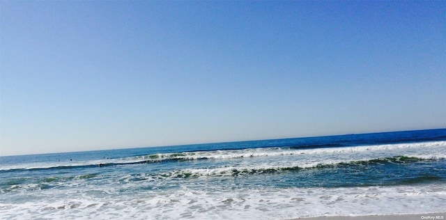 property view of water featuring a beach view