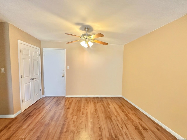 unfurnished room with ceiling fan and light wood-type flooring