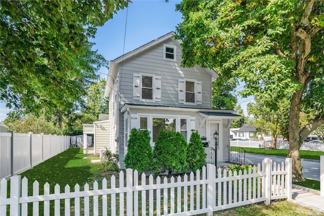 view of front of home with a front lawn