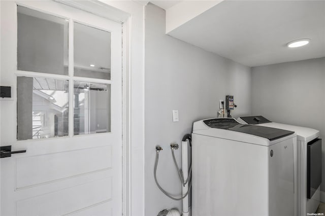 laundry area with washing machine and clothes dryer