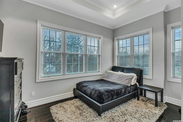 bedroom with crown molding and dark wood-type flooring