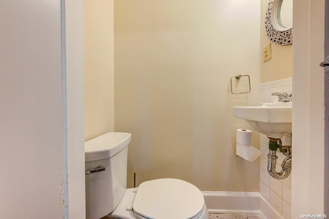 bathroom featuring toilet