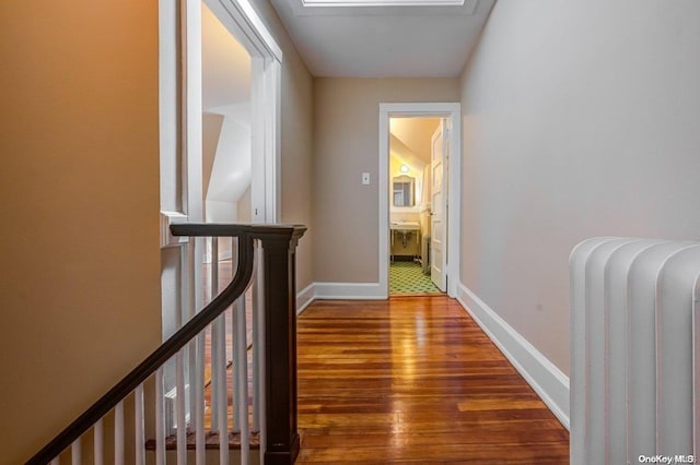 corridor featuring dark wood-type flooring