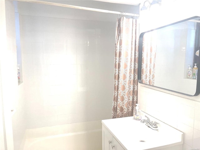 bathroom with vanity and shower / bathtub combination with curtain