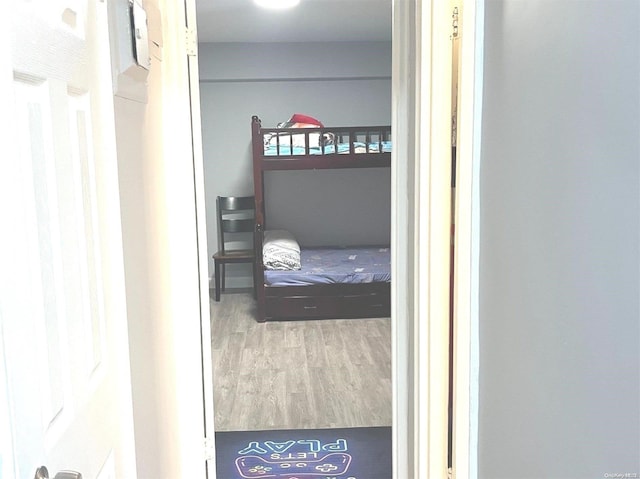 bedroom with hardwood / wood-style flooring