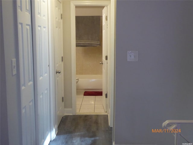 hallway with wood-type flooring