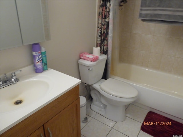 full bathroom featuring tile patterned flooring, shower / bath combination with curtain, vanity, and toilet