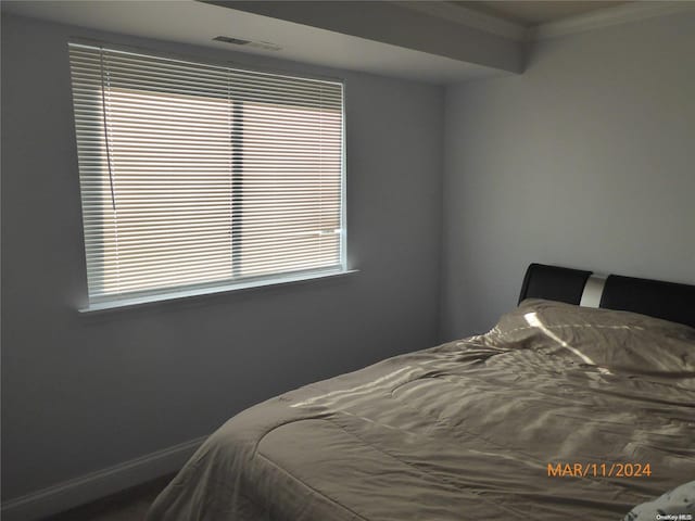 bedroom featuring ornamental molding