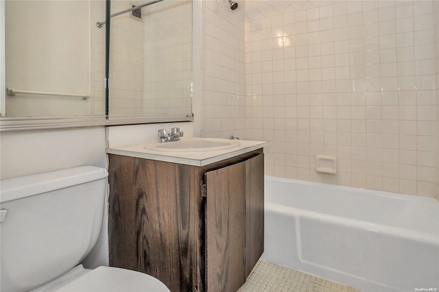 full bathroom featuring tile patterned flooring, vanity, toilet, and tiled shower / bath