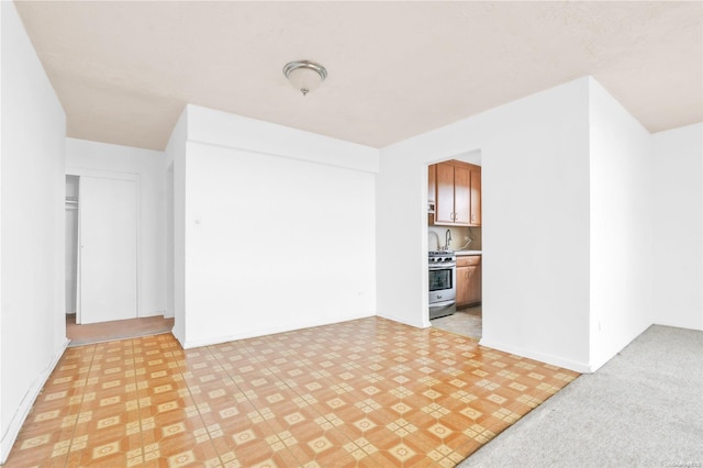 spare room with light colored carpet