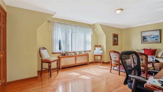 sitting room featuring light hardwood / wood-style floors and ornamental molding