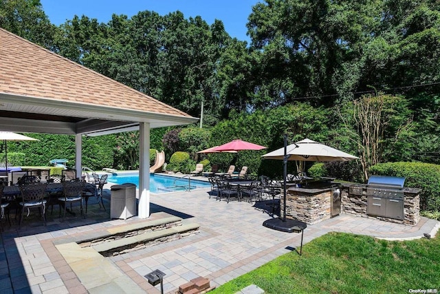 view of patio / terrace featuring area for grilling and a grill