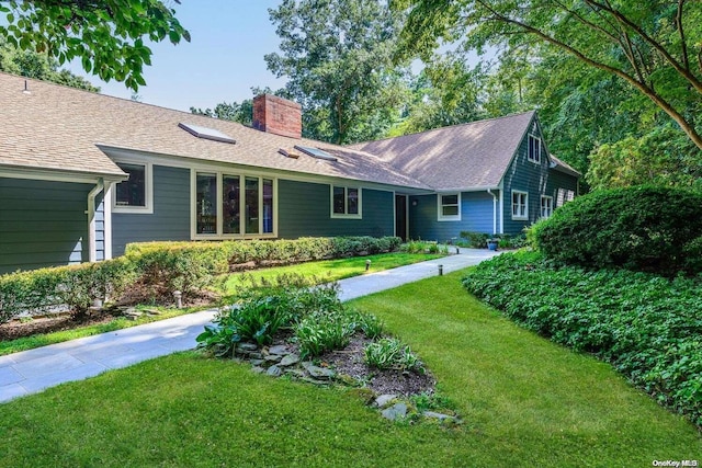 back of house featuring a yard