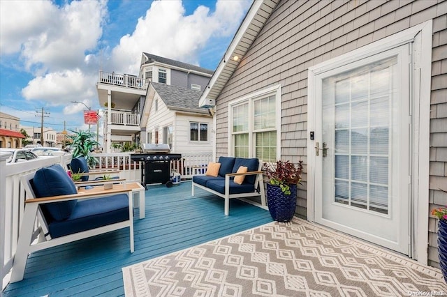 deck featuring an outdoor hangout area and a grill