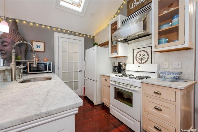 kitchen with white appliances, dark wood-type flooring, ventilation hood, hanging light fixtures, and decorative backsplash