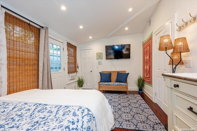 bedroom with dark hardwood / wood-style flooring and lofted ceiling