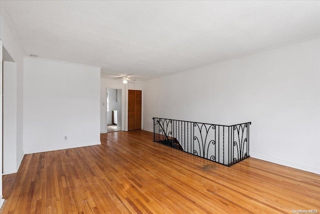 spare room featuring a textured ceiling and hardwood / wood-style flooring