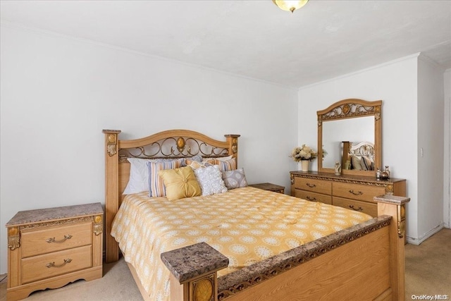 carpeted bedroom featuring ornamental molding