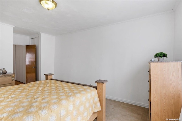 bedroom featuring carpet and crown molding