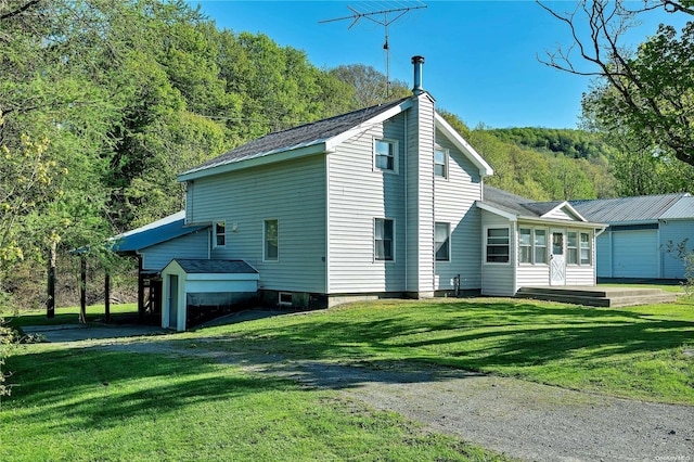 view of home's exterior with a lawn