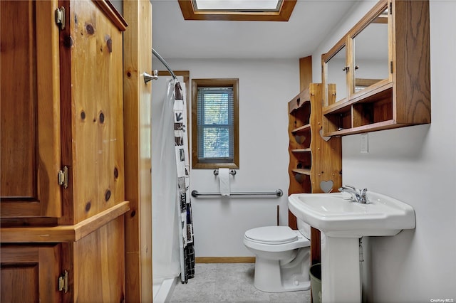 bathroom with a shower with curtain and toilet