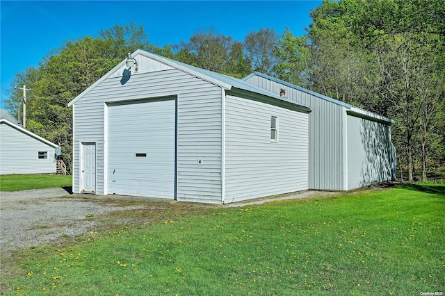 garage with a yard