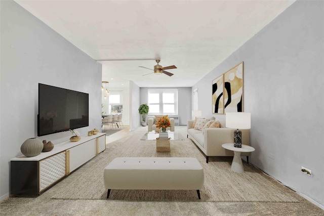 carpeted living room with ceiling fan