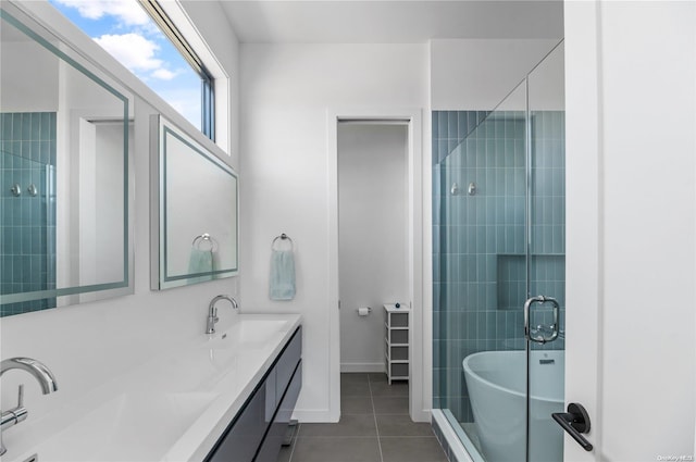 bathroom with shower with separate bathtub, vanity, and tile patterned floors