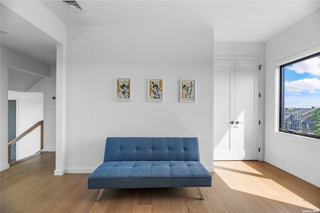 living area with hardwood / wood-style floors