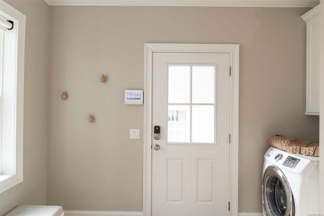 laundry area with cabinets and washer / dryer