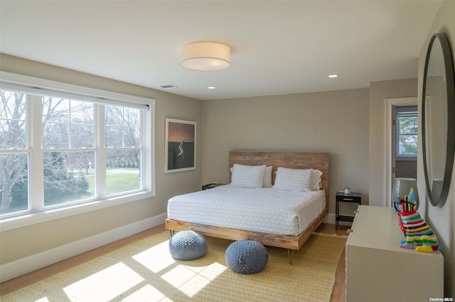 bedroom with light hardwood / wood-style flooring