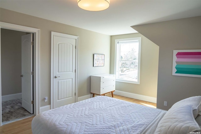 bedroom with light hardwood / wood-style flooring