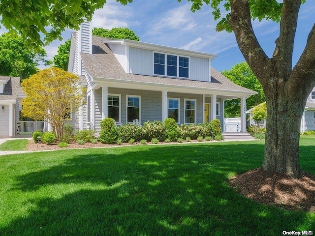 view of front of home featuring a porch and a front lawn